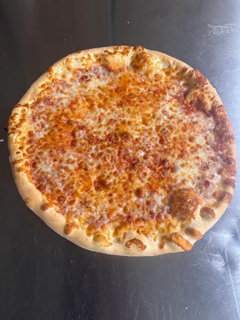 A golden cheese pizza at Elizabeth’s Pizza in Lexington